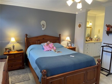 Welcome home to this spacious, remodeled unit in the highly on Sunrise Lakes Phase IV Golf Course in Florida - for sale on GolfHomes.com, golf home, golf lot