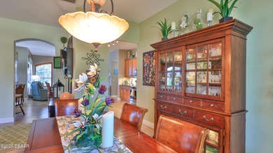 Warm and inviting 4 BR pool home with lake and fountain view on Plantation Bay Golf and Country Club in Florida - for sale on GolfHomes.com, golf home, golf lot