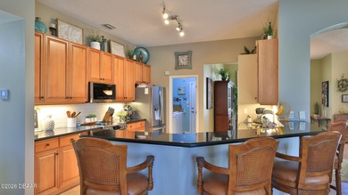 Warm and inviting 4 BR pool home with lake and fountain view on Plantation Bay Golf and Country Club in Florida - for sale on GolfHomes.com, golf home, golf lot