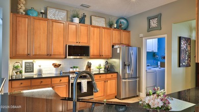 Warm and inviting 4 BR pool home with lake and fountain view on Plantation Bay Golf and Country Club in Florida - for sale on GolfHomes.com, golf home, golf lot