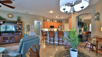 Warm and inviting 4 BR pool home with lake and fountain view on Plantation Bay Golf and Country Club in Florida - for sale on GolfHomes.com, golf home, golf lot