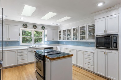 Classic and elegantly designed home with French provincial style on The Seabrook Island Club in South Carolina - for sale on GolfHomes.com, golf home, golf lot