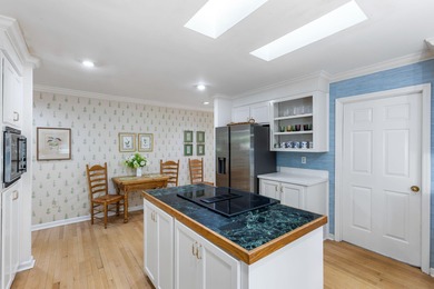 Classic and elegantly designed home with French provincial style on The Seabrook Island Club in South Carolina - for sale on GolfHomes.com, golf home, golf lot