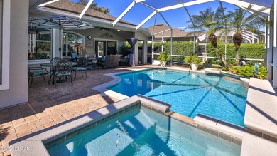 Warm and inviting 4 BR pool home with lake and fountain view on Plantation Bay Golf and Country Club in Florida - for sale on GolfHomes.com, golf home, golf lot