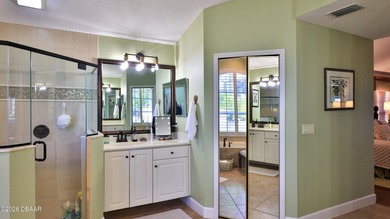 Warm and inviting 4 BR pool home with lake and fountain view on Plantation Bay Golf and Country Club in Florida - for sale on GolfHomes.com, golf home, golf lot