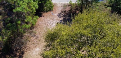 Desirable, partially cleared, 7,600SF lot located on Royal Tern on St. James Bay in Florida - for sale on GolfHomes.com, golf home, golf lot