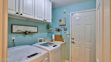 Warm and inviting 4 BR pool home with lake and fountain view on Plantation Bay Golf and Country Club in Florida - for sale on GolfHomes.com, golf home, golf lot