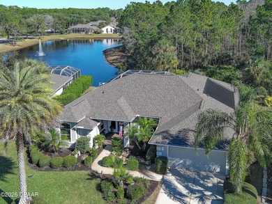 Warm and inviting 4 BR pool home with lake and fountain view on Plantation Bay Golf and Country Club in Florida - for sale on GolfHomes.com, golf home, golf lot