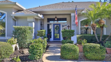 Warm and inviting 4 BR pool home with lake and fountain view on Plantation Bay Golf and Country Club in Florida - for sale on GolfHomes.com, golf home, golf lot