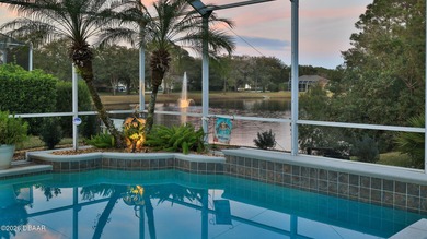 Warm and inviting 4 BR pool home with lake and fountain view on Plantation Bay Golf and Country Club in Florida - for sale on GolfHomes.com, golf home, golf lot