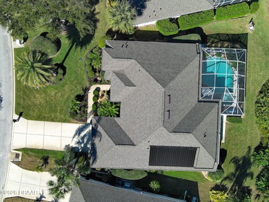 Warm and inviting 4 BR pool home with lake and fountain view on Plantation Bay Golf and Country Club in Florida - for sale on GolfHomes.com, golf home, golf lot