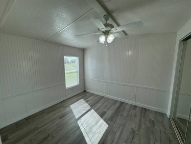 Time to buy is now! This beautiful, totally renovated 2/1.5 bath on Lake Henry Golf Club in Florida - for sale on GolfHomes.com, golf home, golf lot