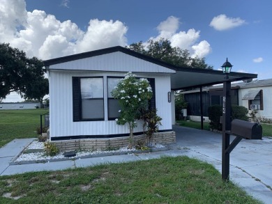 Time to buy is now! This beautiful, totally renovated 2/1.5 bath on Lake Henry Golf Club in Florida - for sale on GolfHomes.com, golf home, golf lot