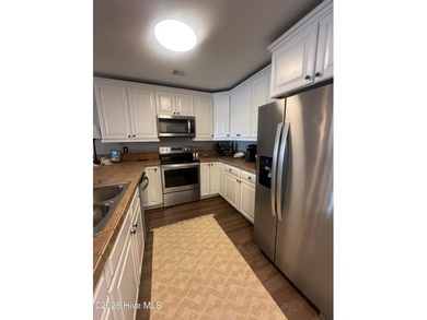 Welcome to coastal living at its finest. This luxurious home on Brick Landing Plantation Yacht and Golf Club in North Carolina - for sale on GolfHomes.com, golf home, golf lot