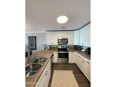 Welcome to coastal living at its finest. This luxurious home on Brick Landing Plantation Yacht and Golf Club in North Carolina - for sale on GolfHomes.com, golf home, golf lot