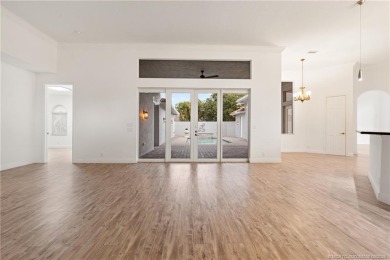 Welcome to your own private sanctuary-an elegant courtyard pool on The Cape Club of Palm City in Florida - for sale on GolfHomes.com, golf home, golf lot