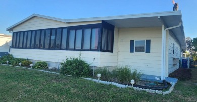A delightful 2-bedroom, 2-bathroom home in Winter Haven, FL on Lake Henry Golf Club in Florida - for sale on GolfHomes.com, golf home, golf lot