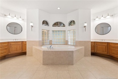 Welcome to your own private sanctuary-an elegant courtyard pool on The Cape Club of Palm City in Florida - for sale on GolfHomes.com, golf home, golf lot