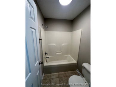 Welcome to this beautifully renovated 3-bedroom, 2-bathroom home on Hope Mills Golf and Country Club in North Carolina - for sale on GolfHomes.com, golf home, golf lot
