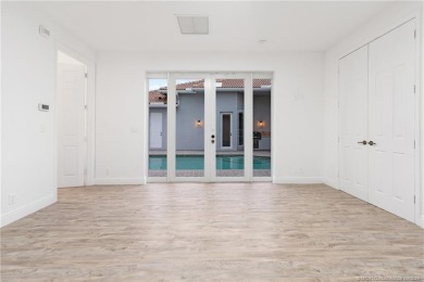 Welcome to your own private sanctuary-an elegant courtyard pool on The Cape Club of Palm City in Florida - for sale on GolfHomes.com, golf home, golf lot