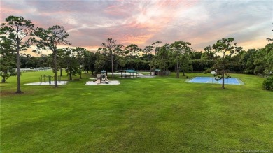 Welcome to your own private sanctuary-an elegant courtyard pool on The Cape Club of Palm City in Florida - for sale on GolfHomes.com, golf home, golf lot