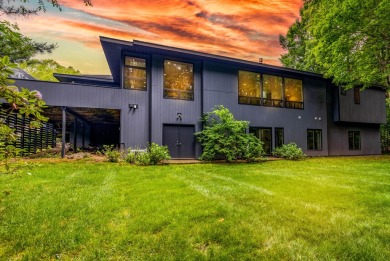This Mid-Century Modern masterpiece is located near Lake on Grand Haven Golf Club in Michigan - for sale on GolfHomes.com, golf home, golf lot