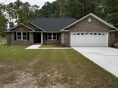 The Willow, by Gainey Construction, sits on more than a half on Sunset Country Club in South Carolina - for sale on GolfHomes.com, golf home, golf lot