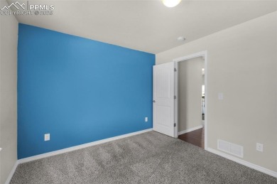 Live boldly in this vibrant 5-bedroom corner-lot beauty with no on Antler Creek Golf Course in Colorado - for sale on GolfHomes.com, golf home, golf lot