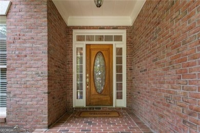 Nestled on a beautifully landscaped half-acre lot in on Chapel Hills Golf and Country Club in Georgia - for sale on GolfHomes.com, golf home, golf lot