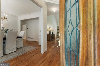 Nestled on a beautifully landscaped half-acre lot in on Chapel Hills Golf and Country Club in Georgia - for sale on GolfHomes.com, golf home, golf lot