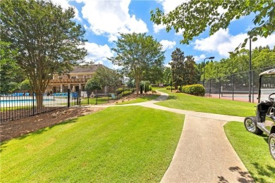 NOW WITH A NEW ROOF! Conveniently located on hole two of Mirror on Mirror Lake Golf Club in Georgia - for sale on GolfHomes.com, golf home, golf lot