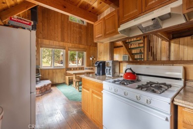 Enveloped by a quiet grove of mature pines and backing to a on Big Bear Mountain Ski and Golf Resort in California - for sale on GolfHomes.com, golf home, golf lot