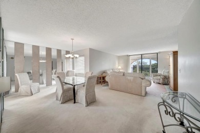 SPACIOUS 2/2 PENTHOUSE CORNER UNIT IN MANICURED 55+ LAKES OF on Inverrary Country Club in Florida - for sale on GolfHomes.com, golf home, golf lot