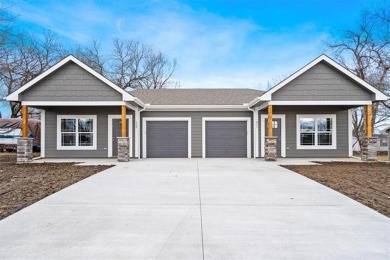 Welcome to this beautiful new construction 2-unit townhouse on Ottawa Country Club in Kansas - for sale on GolfHomes.com, golf home, golf lot