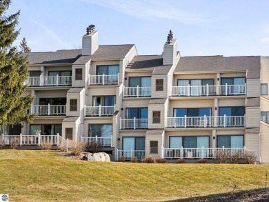 Step into luxury living at this meticulously maintained condo on Grand Traverse Resort and Spa in Michigan - for sale on GolfHomes.com, golf home, golf lot