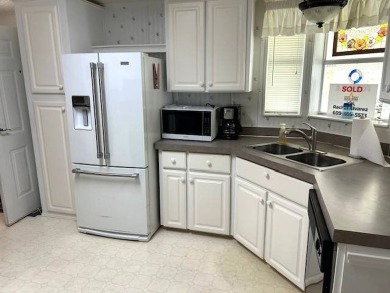 This beautifully maintained 2-bedroom, 2-bathroom home is being on Crystal Lake Club in Florida - for sale on GolfHomes.com, golf home, golf lot