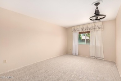 Discover Sun City Living in this charming 2-bed, 2-bath Gemini on Sun City Lakes West and East in Arizona - for sale on GolfHomes.com, golf home, golf lot