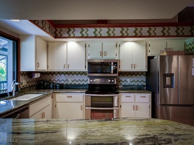 Welcome to 1379 Albatross Road, a private tropical retreat on The Dunes Golf and Tennis Club in Florida - for sale on GolfHomes.com, golf home, golf lot