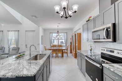 Charming Dreamsicle Cottage located in Latitude Daytona Beach on LPGA International Golf Course in Florida - for sale on GolfHomes.com, golf home, golf lot