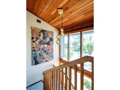 Welcome to 1379 Albatross Road, a private tropical retreat on The Dunes Golf and Tennis Club in Florida - for sale on GolfHomes.com, golf home, golf lot