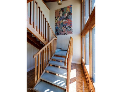 Welcome to 1379 Albatross Road, a private tropical retreat on The Dunes Golf and Tennis Club in Florida - for sale on GolfHomes.com, golf home, golf lot