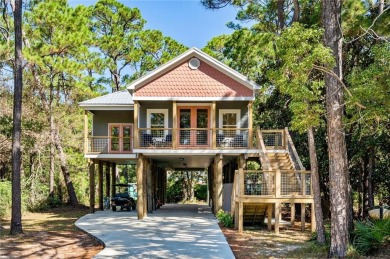 This adorable 3 bed/3 bath Modern Coastal cottage has everything on Isle Dauphine Club Golf Course in Alabama - for sale on GolfHomes.com, golf home, golf lot