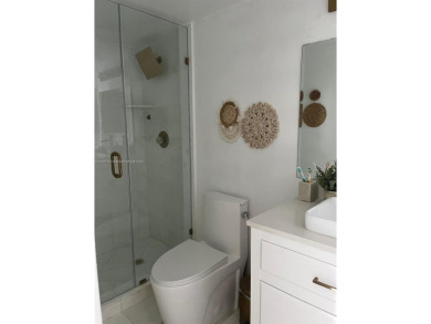 This elegant and bright corner 2-bedroom, 2-bath condo features on Turnberry Isle Resort and Club in Florida - for sale on GolfHomes.com, golf home, golf lot