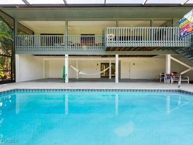 Welcome to 1379 Albatross Road, a private tropical retreat on The Dunes Golf and Tennis Club in Florida - for sale on GolfHomes.com, golf home, golf lot