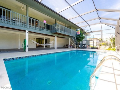 Welcome to 1379 Albatross Road, a private tropical retreat on The Dunes Golf and Tennis Club in Florida - for sale on GolfHomes.com, golf home, golf lot