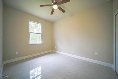 BRAND NEW CONSTRUCTION ON A 1/2 Acre Lot With A Fenced-In Back on Lehigh Resort Club in Florida - for sale on GolfHomes.com, golf home, golf lot