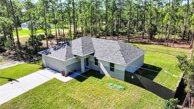 BRAND NEW CONSTRUCTION ON A 1/2 Acre Lot With A Fenced-In Back on Lehigh Resort Club in Florida - for sale on GolfHomes.com, golf home, golf lot