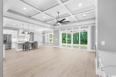 This brand-new custom home boasts 5 spacious bedrooms and 4 on Wild Wing Plantation in South Carolina - for sale on GolfHomes.com, golf home, golf lot