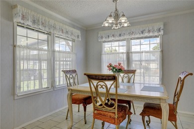 Fruit Trees, Sunshine & Freedom-it's all here on a fenced lot on Barefoot Bay Golf Course in Florida - for sale on GolfHomes.com, golf home, golf lot