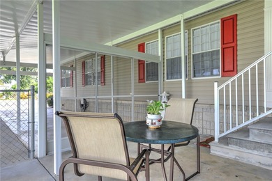 Fruit Trees, Sunshine & Freedom-it's all here on a fenced lot on Barefoot Bay Golf Course in Florida - for sale on GolfHomes.com, golf home, golf lot